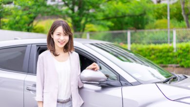Woman next to car